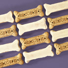 Barker’s Dozen,  12 large bone-shaped treats dipped in dog-safe white confection